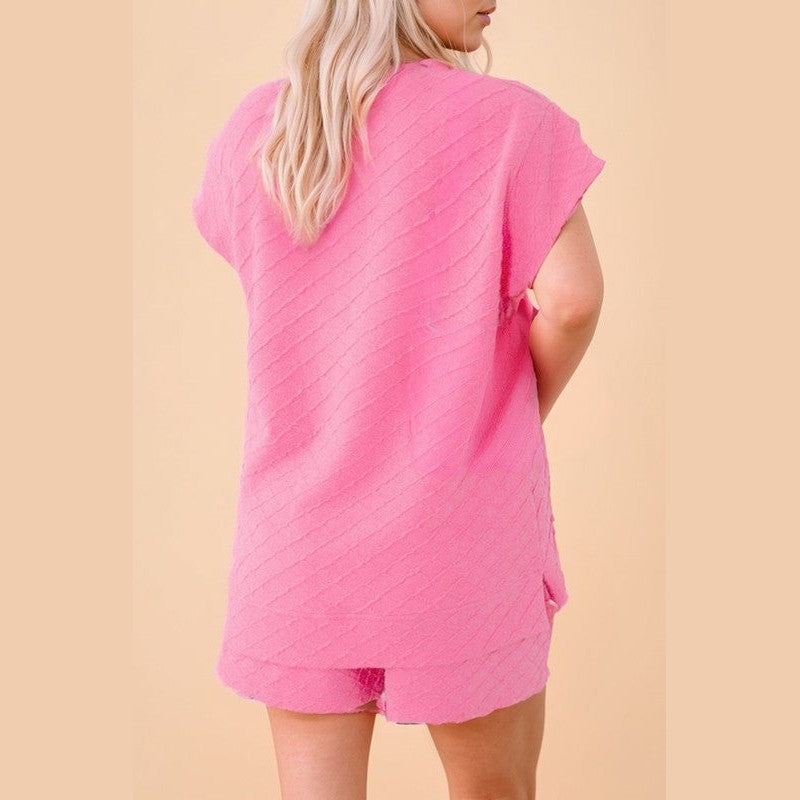 Back view of woman wearing pink summer casual drawstring shorts outfit by SHEWIN INC