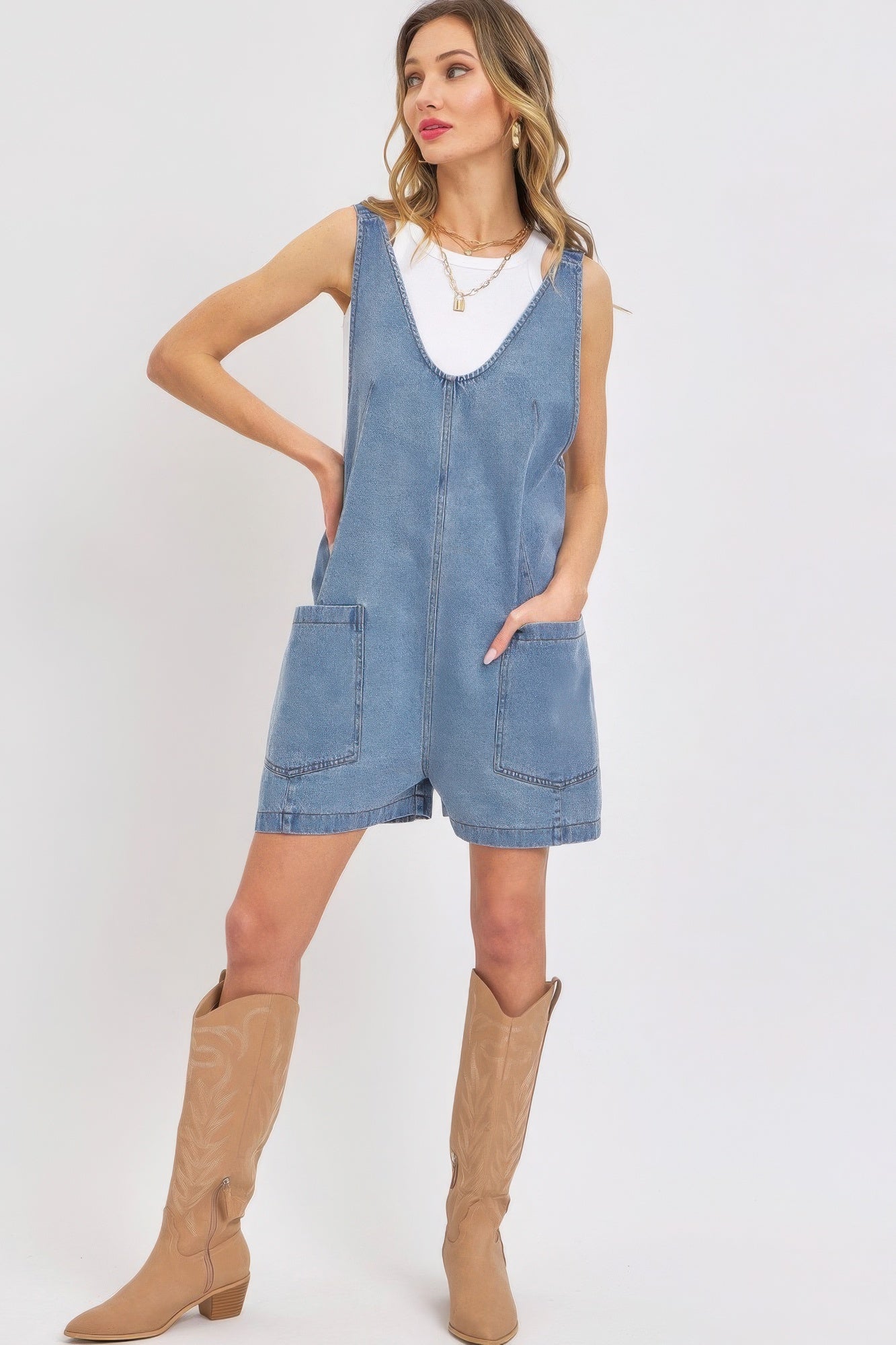 Stylish summer denim romper for women with pockets and a relaxed fit, perfect for casual outings