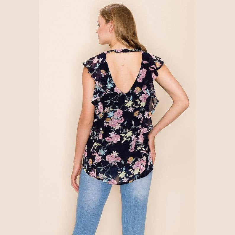 Back view of a women's summer floral print blouse with ruffle sleeves from Shopin LA
