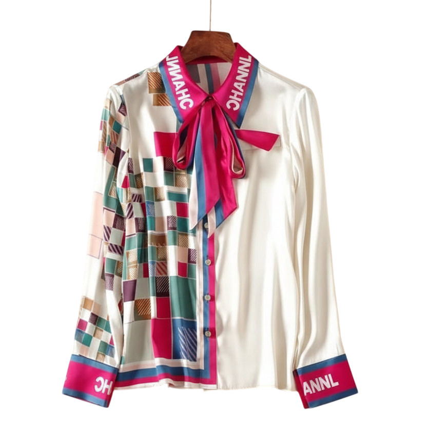 White shirt with colorful plaid pattern and brand name on a white background