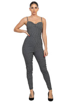 Stylish black and white summer travel jumpsuit for women with fitted design and spaghetti straps