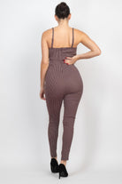 Back view of a stylish vacation Grabs summer travel jumpsuit for women in a dotted pattern