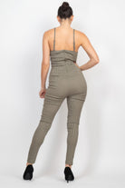 Back view of a stylish summer travel jumpsuit for women from VacationGrabs with a fitted design