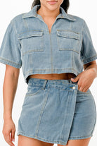 Stylish denim two-piece set featuring a cropped top and high-waisted skirt, perfect summer travel outfits for women