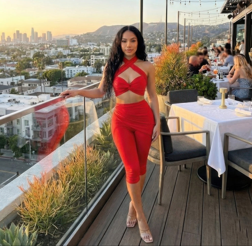 Women's red summer two-piece vacation outfit, perfect for rooftop dining