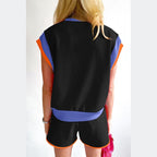 YNIQUE summer vacation two piece outfit with black top and shorts accented with blue and orange trim
