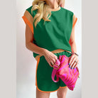 YNIQUE summer vacation two piece outfit in green with orange trim and matching shorts