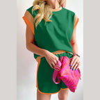 YNIQUE summer vacation two piece outfit in green with orange trim and matching shorts