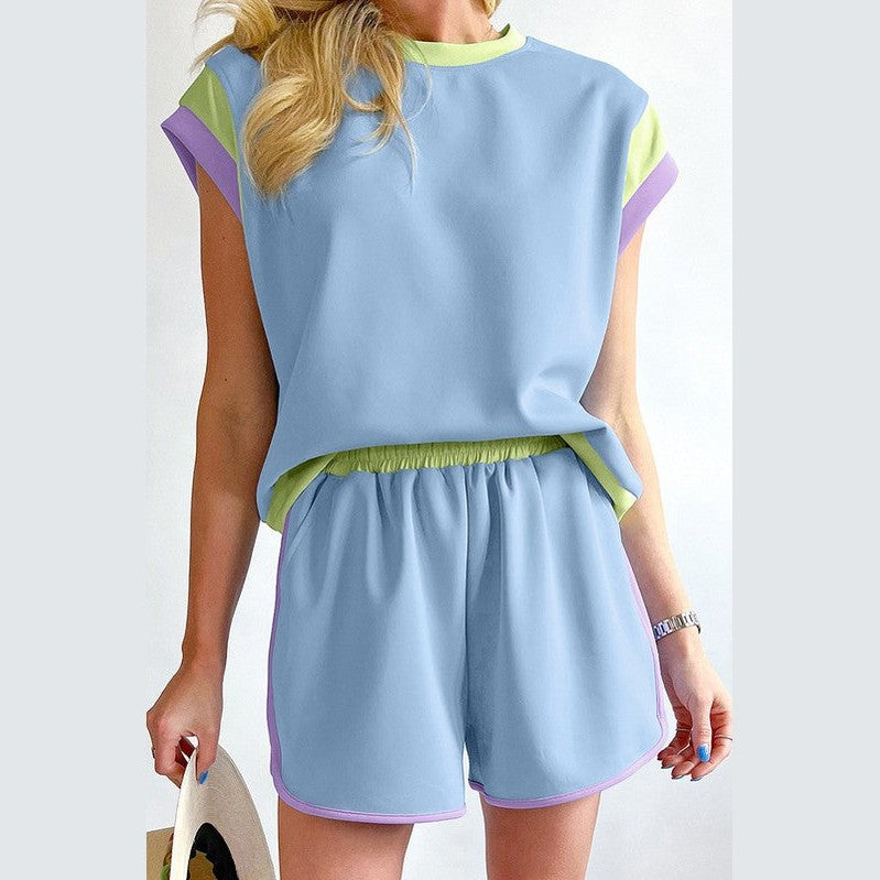 YNIQUE summer vacation two piece outfit with blue top and matching shorts with green and purple accents