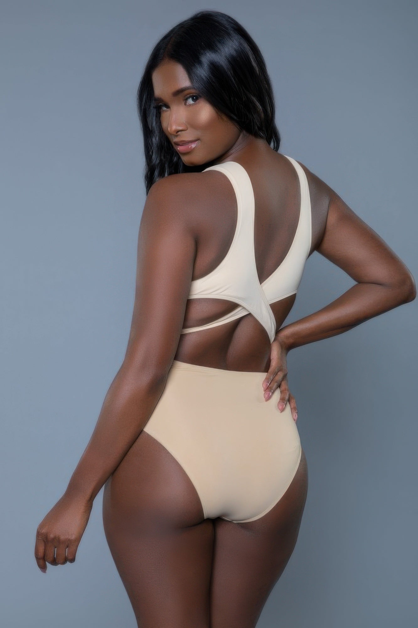 Women's beige swimmers swimwear, one-piece, perfect for poolside relaxation