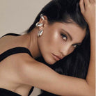 Elegant model wearing Tamara chunky hoop earrings that add a modern touch to any outfit