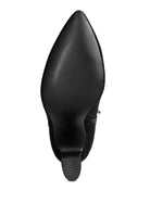 Sole of tan suede ankle boots by Rag Company showcasing a sleek pointed design