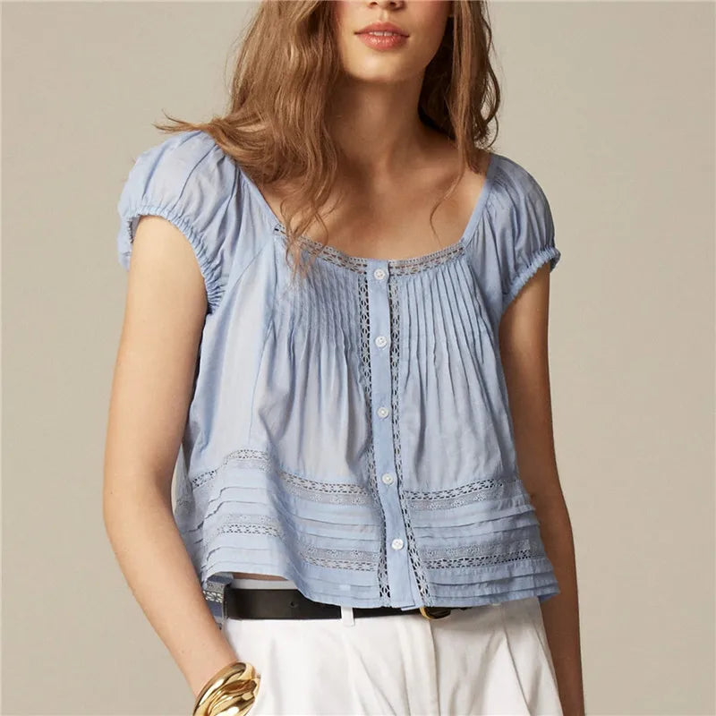Women's light blue shirt with lace details, perfect for casual outings