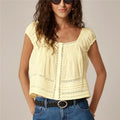 Women's yellow tank top with lace, perfect for casual summer outings