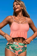 Women's pink tankini with tropical print, perfect for beachwear
