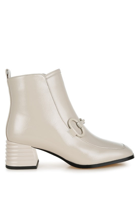 Stylish textured ankle boots for women in beige with a unique buckle detail and block heel