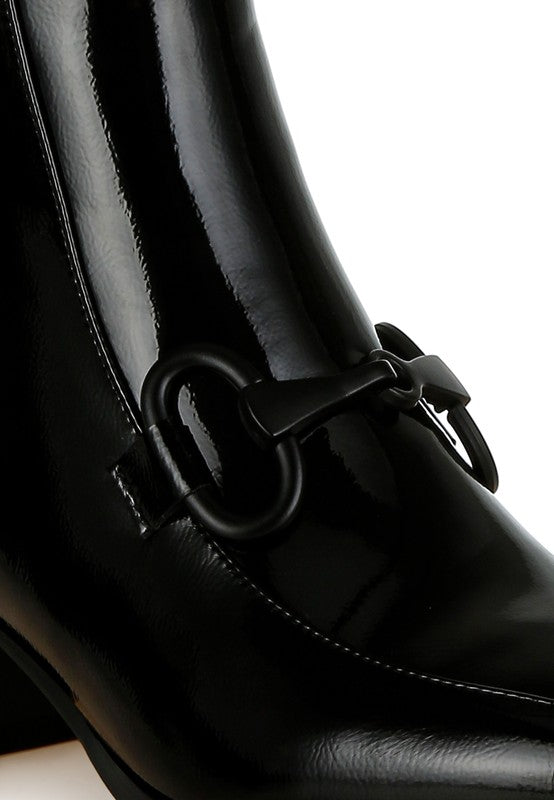 Shiny black textured ankle boots for women with stylish decorative buckle detail