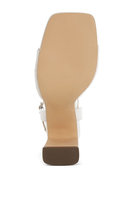 Women's white textured faux leather heels, stylish for formal events