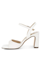 Women's white textured faux leather heels for elegant occasions