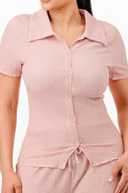 Women's textured pink pants set with short sleeves and button-up top from VacationGrabs