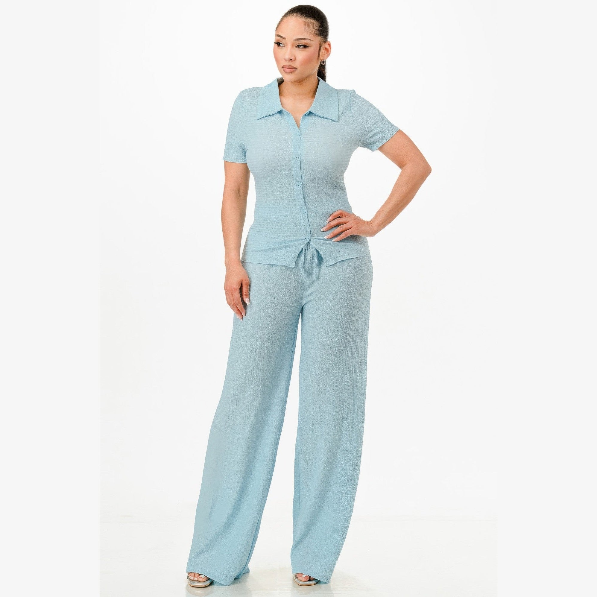 Light blue textured polo set for women featuring a short sleeve top and wide-leg pants