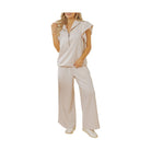 JUNIPER BLVD textured ruffle lounge set featuring a zip-up top and wide-leg pants in a soft, neutral tone