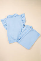 Textured ruffle lounge set in light blue featuring a stylish short-sleeve top and matching pants