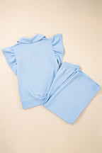 Textured ruffle lounge set in light blue featuring a stylish short-sleeve top and matching pants