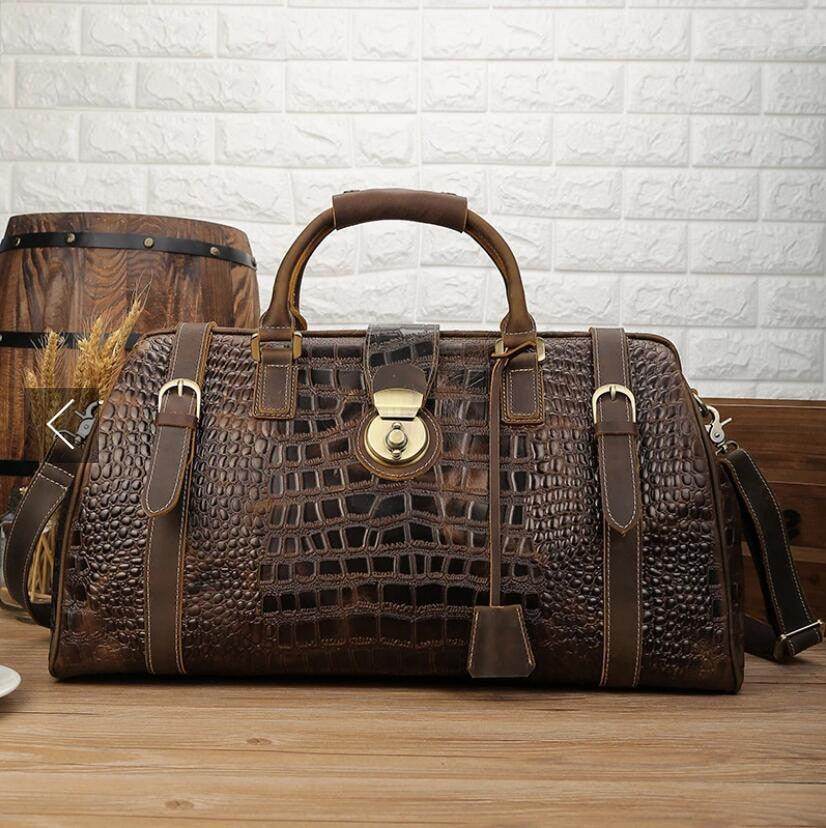 Textured travel weekender bag in brown with riveted handles and stylish design for weekend getaways