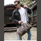 Stylish man carrying a textured travel weekender bag in a casual outdoor setting