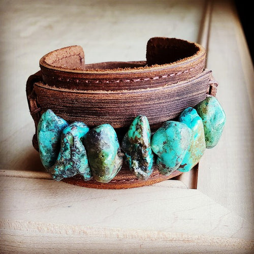 Leather cuff with natural turquoise featuring unique stone accents for stylish accessories