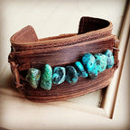 Handcrafted leather cuff with natural turquoise stones features earthy tones and unique design