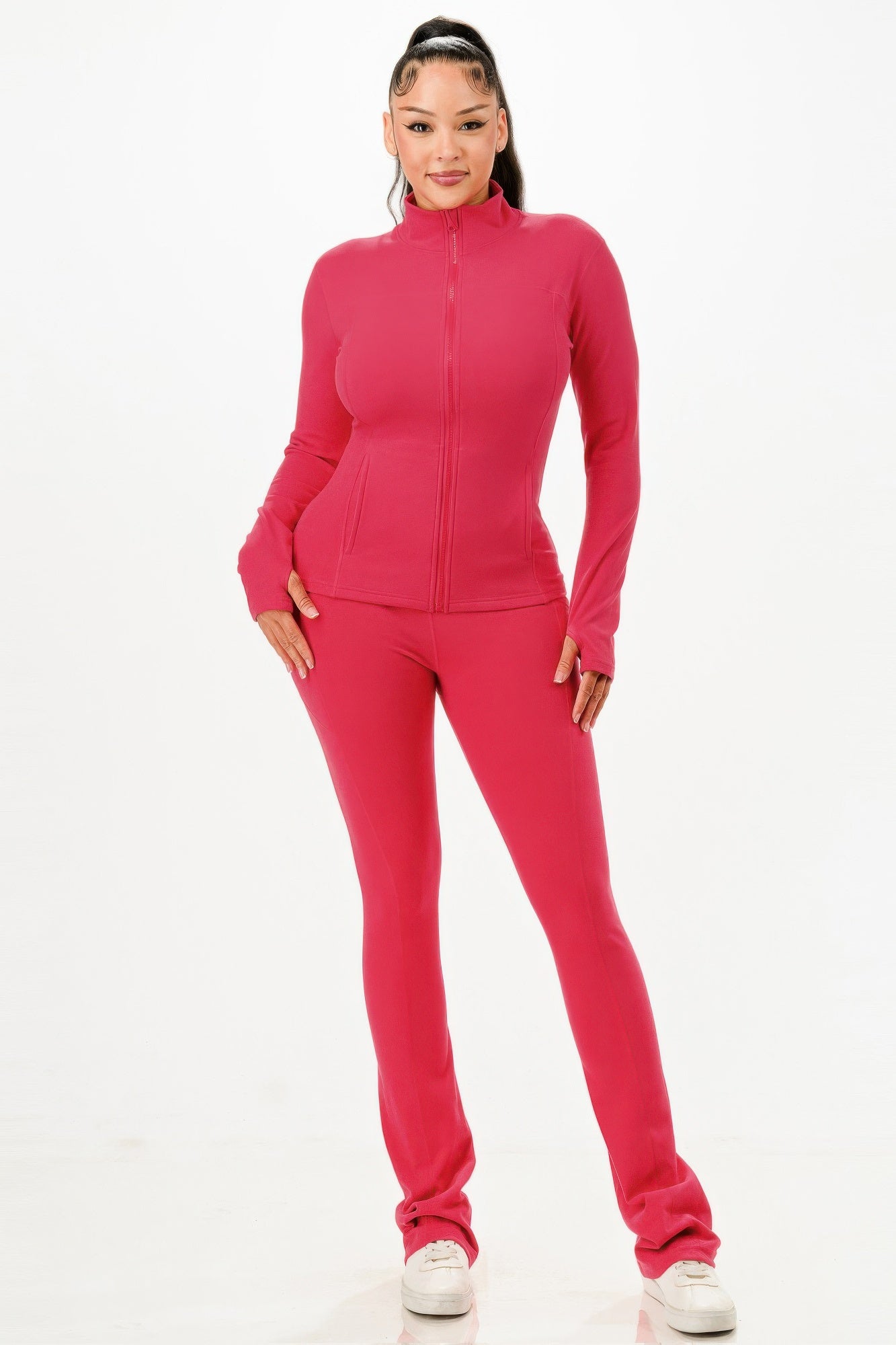 Women in a pink thermal activewear set for women with zip-up jacket and fitted pants