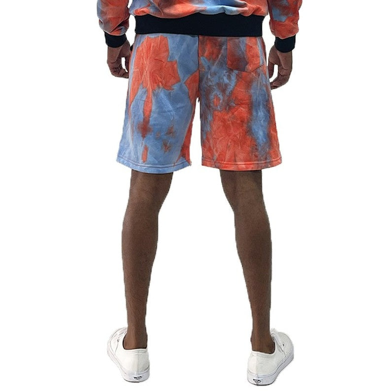 Back view of tie dye lounge shorts for men in blue and orange by WEIV, worn with white sneakers