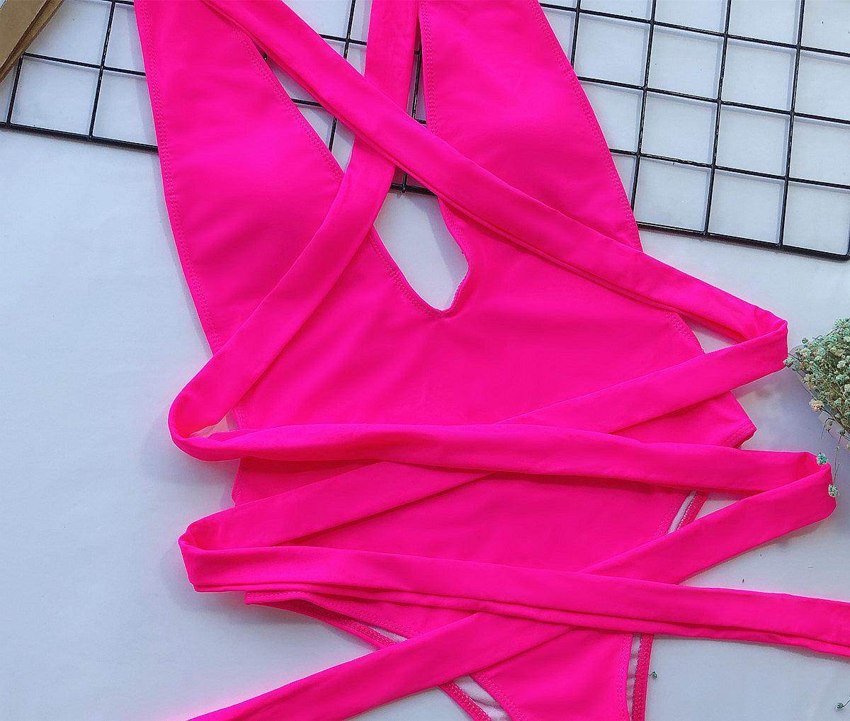 Trendsi tied one-piece swimwear in vibrant pink with stylish strap design for chic beach days