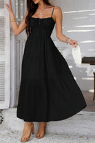 Black tiered cami vacation dress with adjustable straps and flowy silhouette for summer outings
