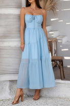 Light blue tiered cami vacation dress with a delicate bodice and flowy skirt, perfect for summer outings