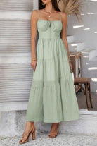 Light green tiered cami vacation dress with adjustable straps for sunny getaways