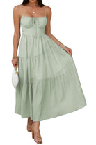 Women's tiered cami vacation dress in light green, featuring a flowy design and adjustable straps