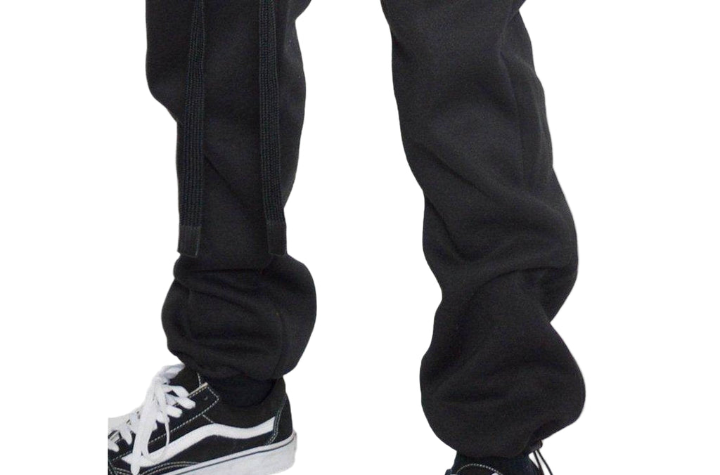 Men's activewear featuring black toggle sweats for men paired with stylish sneakers