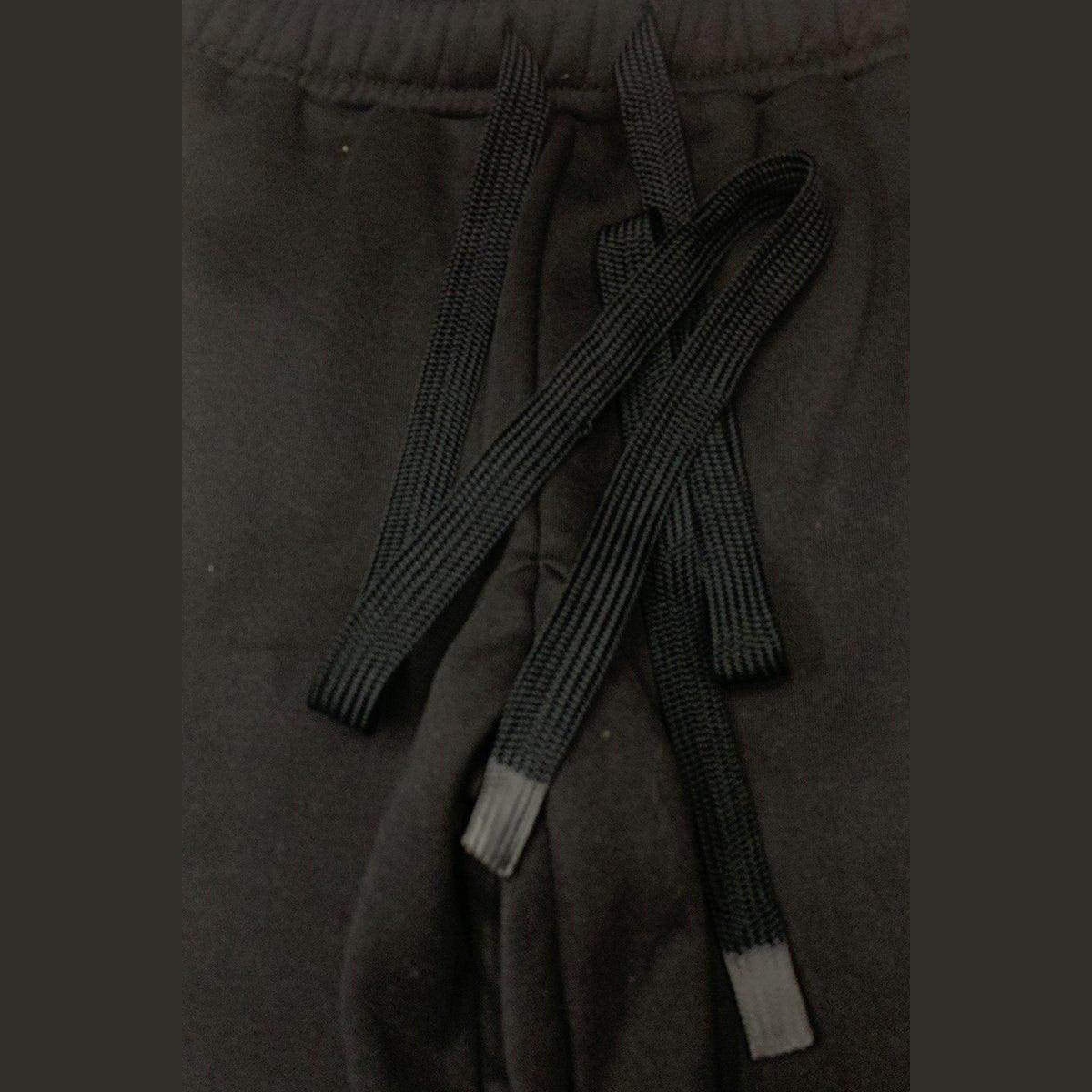 Close-up of black drawstring detail on toggle sweats for men by VacationGrabs