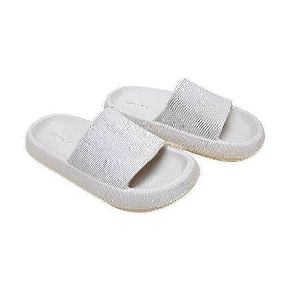 Women's vacation style sandals in white with a comfortable slip-on design for casual outings