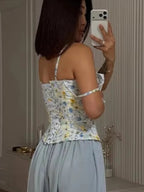 Women's floral top cami in pastel colors, perfect for warm weather