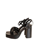 Stylish black cross ankle strap heels with chunky block heels for a fashionable look