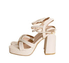 Stylish Top Guy Footwear cross ankle strap heels in nude with chunky platform for elegant occasions
