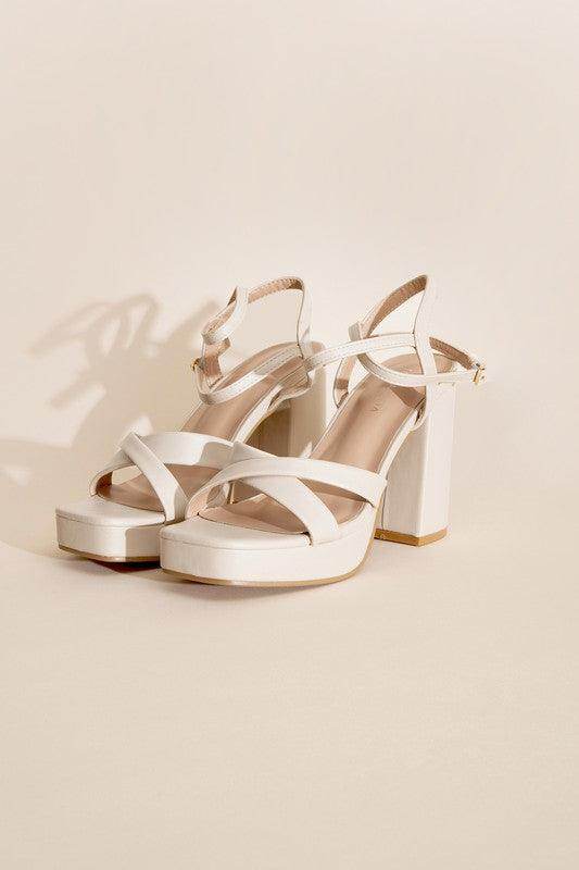 Elegant white cross ankle strap heels with chunky block heels for stylish women