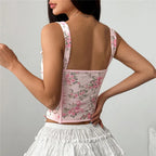 Women's floral top with corset detail, perfect for summer outings