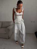 Women's white top with corset, ruffled sleeves and peplum design for casual outings