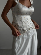 Women's floral top with corset, designed for stylish layering and evening wear