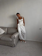 Women's white top with corset detailing, perfect for stylish outings